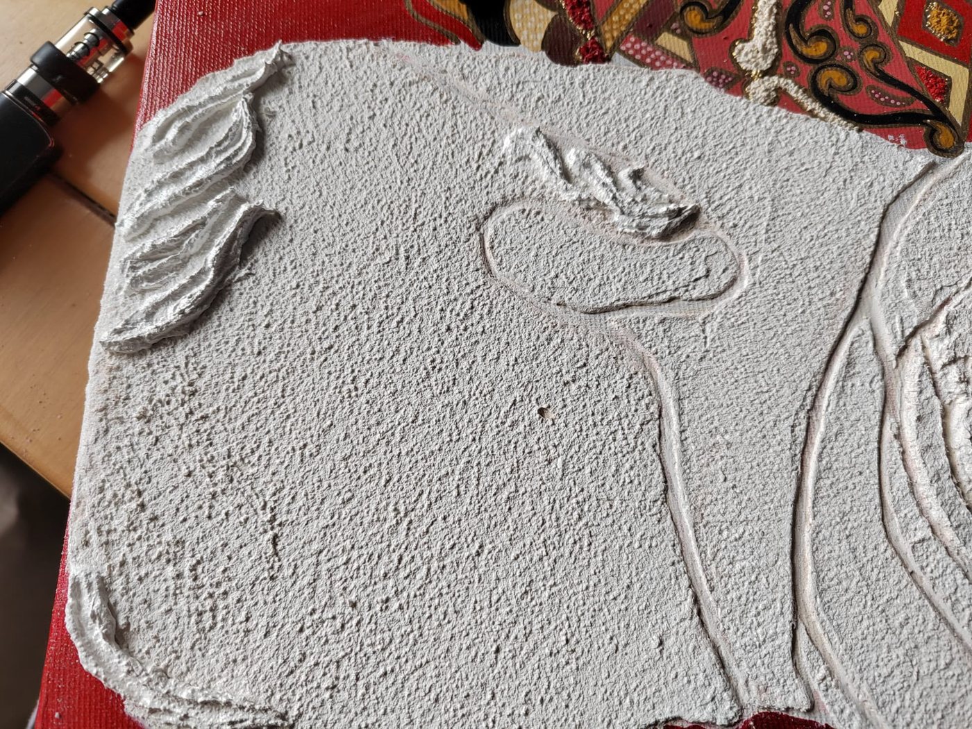 Relief plaster surface worked by hand